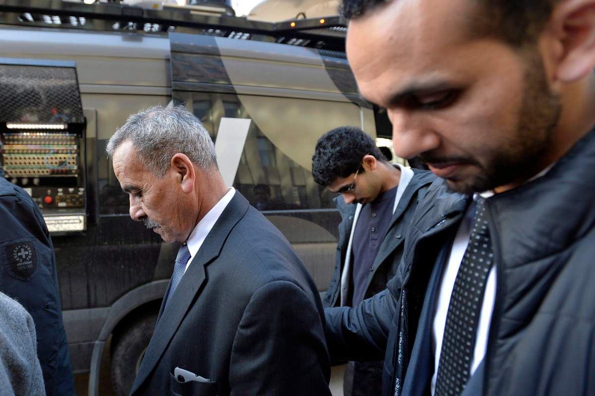 Mohammed Jaser, centre, father of Raed Jaser, leaves court after two men accused of plotting to attack a Via Rail passenger train travelling from New York to Toronto were found guilty of terror-related charges in Toronto, March 20, 2015. THE CANADIAN PRESS/Nathan Denette