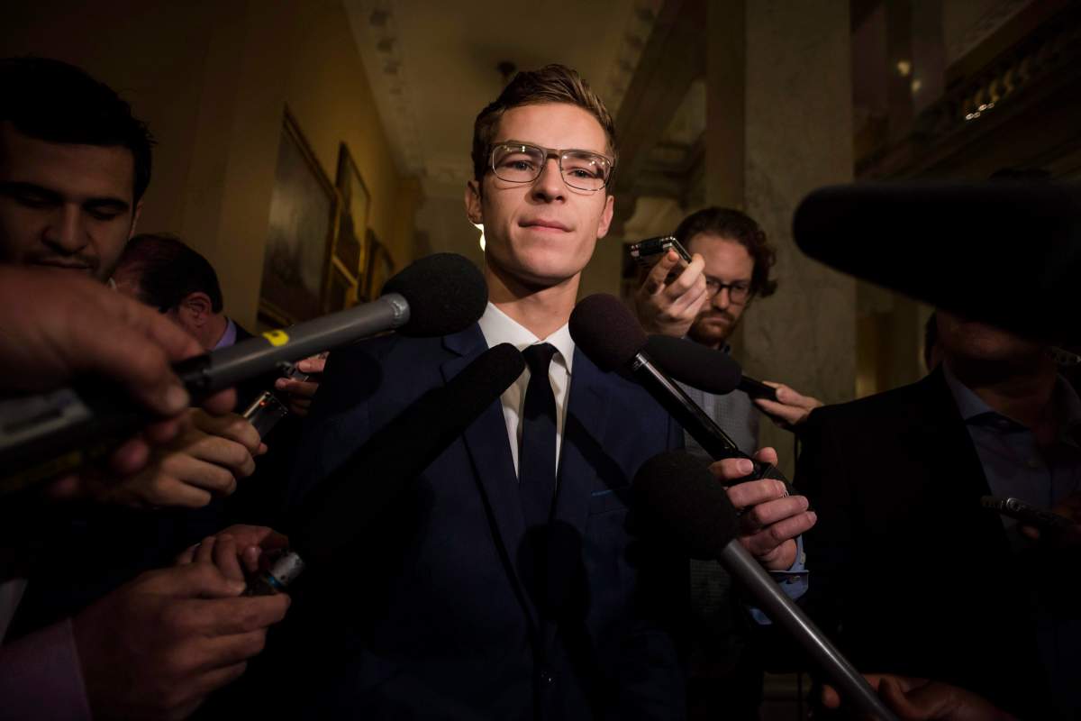 Sam Oosterhoff speaks to members of the media.