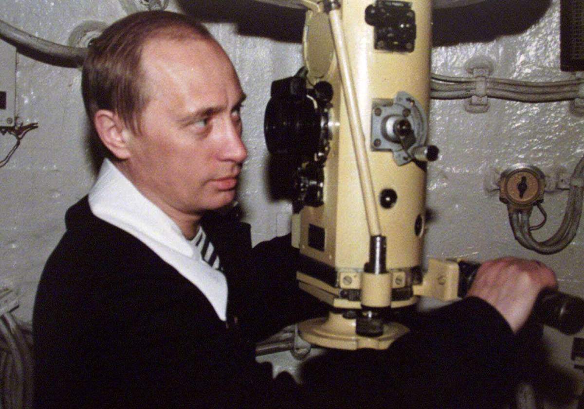 In this file photo taken in April 6, 2000, Russian President Vladimir Putin looks through the periscope of a nuclear submarine during a visit to the Northern Fleet on the Barents Sea, Russia.