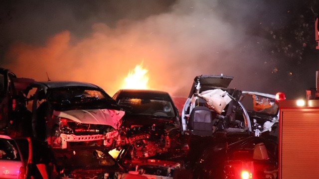Surrey fire crews douse flames amid vehicle scrap heap - image