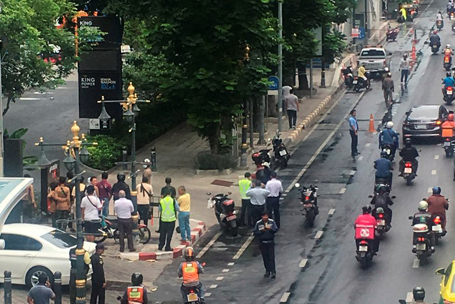 A crowd gathers near the site where explosions were heard in Bangkok, Thailand August 2, 2019, in this image obtained via social media. 