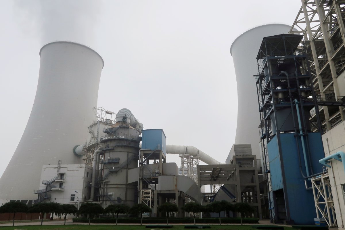 Smoke is seen from a cooling tower of a China Energy ultra-low emission coal-fired power plant during a media tour, in Sanhe, Hebei province, China July 18, 2019.   