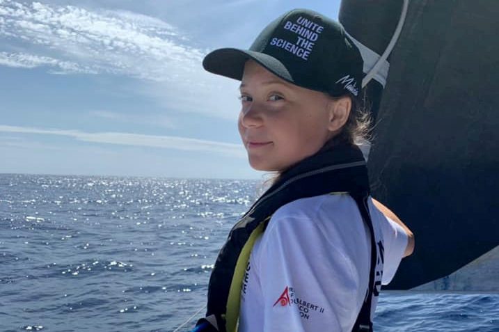 Swedish 16-year-old activist Greta Thunberg stands on the bow of the Malizia II racing yacht as she completes half of her trans-Atlantic crossing at sea August 20, 2019 in this picture obtained from social media. TEAM MALIZIA via REUTERS THIS IMAGE HAS BEEN SUPPLIED BY A THIRD PARTY. MANDATORY CREDIT. NO RESALES. NO ARCHIVES.