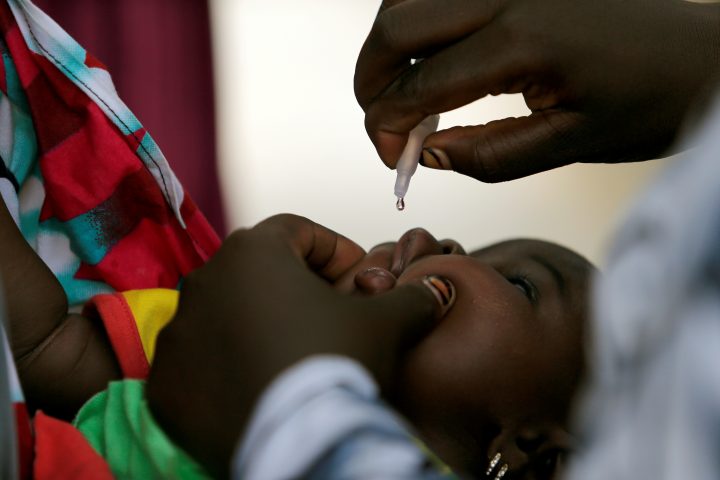A child is given a dose of polio vaccine at an immunisation health centre in Maiduguri, Borno State, Nigeria, August 29, 2016. 