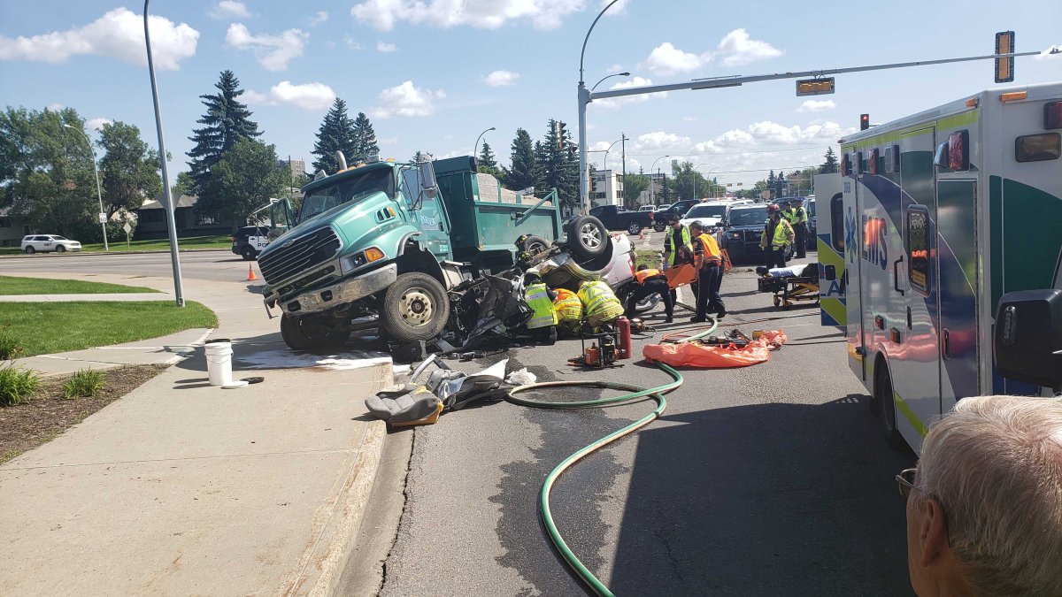 A dump truck and a car collided at the intersection of 111 Avenue and Groat Road in central Edmonton on Wednesday, August 7, 2019. 
