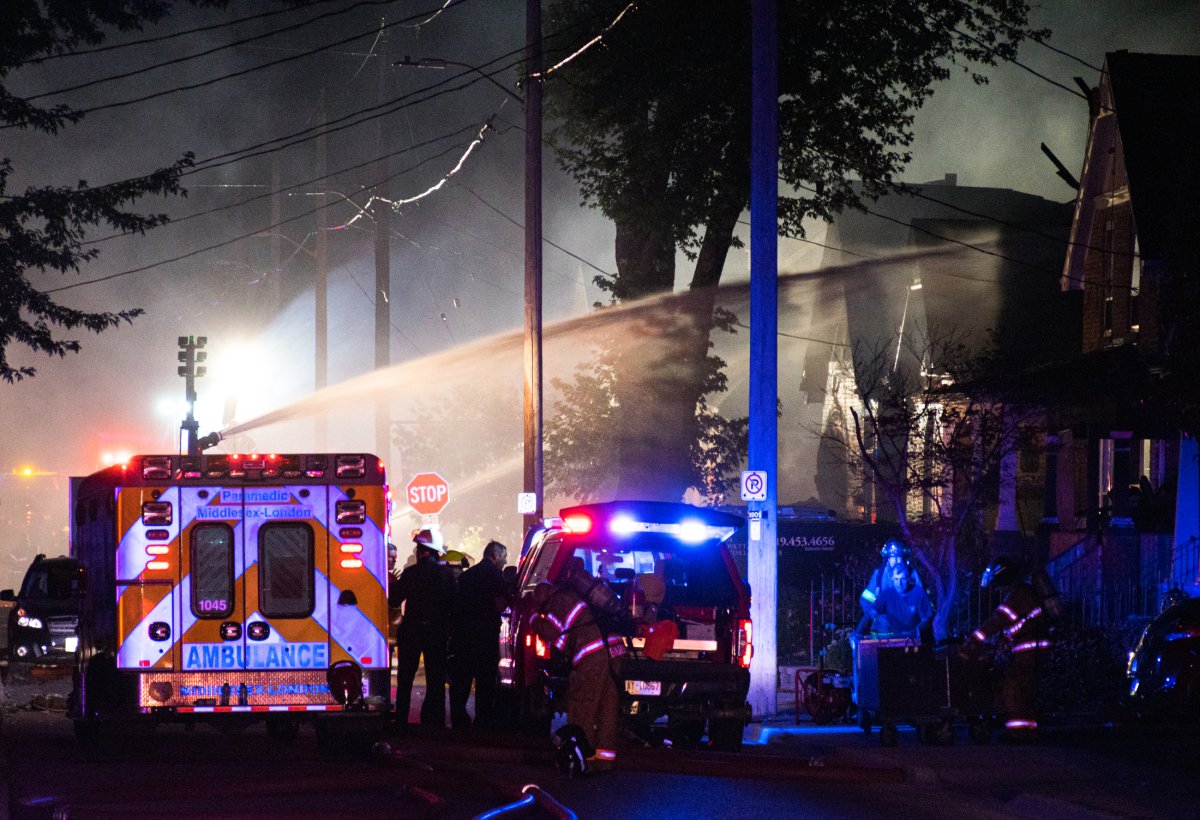 First responders attend to the aftermath of an explosion on Woodman Avenue in 2019.