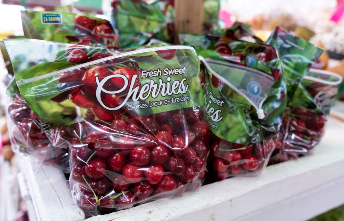 FILE - Cherries wrapped in a plastic bag are seen at a market in Montreal on Thursday, June 13, 2019. 