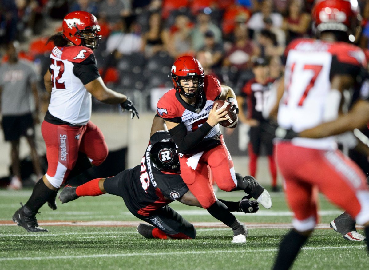 Calgary Stampeders quarterback Nick Arbuckle runs the ball during second half CFL action against the Ottawa Redblacks in Ottawa on Thursday, July 25, 2019. 