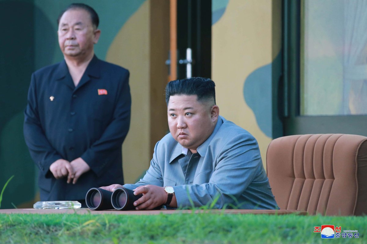 A photo released by the official North Korean Central News Agency (KCNA) on 26 July 2019 shows Kim Jong-Un (R), chairman of the Workers' Party of Korea, and leader of the nation, overseeing the launch of a new-type tactical guided weapon, in North Korea, 25 July 2019.