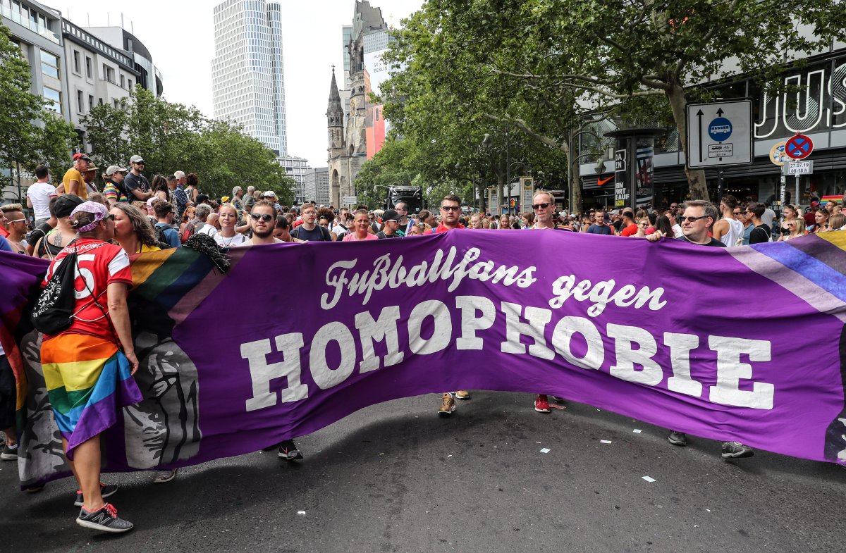 People carry a banner reading "Football fans against homophobia" in the 41th Christopher Street Day LGBT parade in Berlin, Germany, 27 July 2019. 
