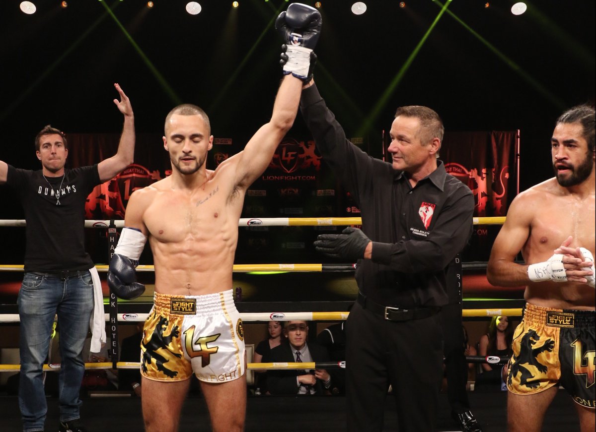 One-handed Calgary Muay Thai fighter Jake Peacock has his arm raised in victory after stopping American welterweight John Garcia with a head kick in the first round Saturday night at Lion Fight 57. The 26-year-old Peacock was born without a right hand or forearm. 