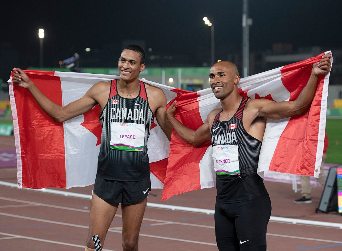 Canada's Damian Warner, right, celebrates his gold medal win in the decathlon with teammate Pierce LePage who won bronze at the Pan Am Games in Lima, Peru on Wednesday, Aug. 7, 2019.