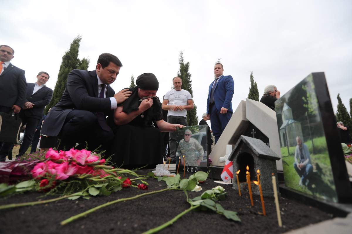 People attend a wreath laying ceremony at a cemetery in Tbilisi, Georgia, 08 August 2019. An official ceremony was held here on the occasion of the eleventh anniversary of the Russian-South Ossetian-Georgian conflict, or Russo-Georgian War of August 2008.