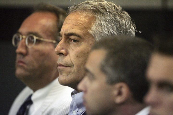 In this July 30, 2008, file photo, Jeffrey Epstein, center, appears in court in West Palm Beach, Fla.  