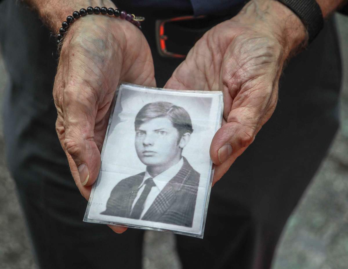 This Wednesday, Aug. 7, 2019 photo shows Brian Toale shows a photo of himself at 16 years old in New York.  