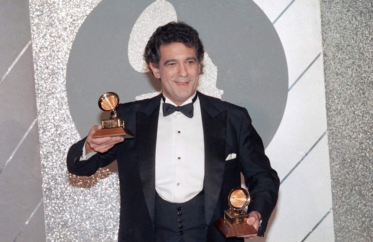 In this Feb. 26, 1985 file photo, Placido Domingo holds his two trophies during the Grammy Awards ceremonies.