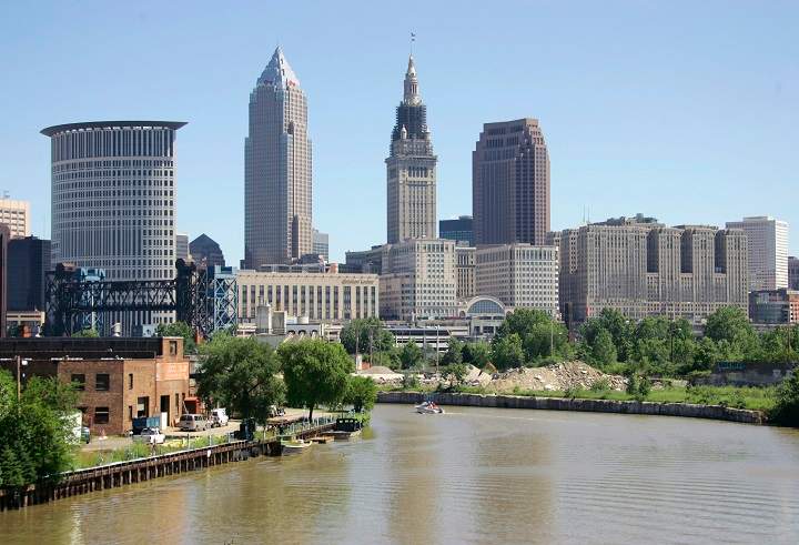 FILE  This July 15, 2008, file photo shows the Cuyahoga River in Cleveland. A new report says cleaning up some of the Great Lakes region's most heavily polluted areas has led to billions of dollars' worth of economic development and brought communities closer together. The report highlights 10 places where cleanups have spurred development, including the Cuyahoga River in Cleveland. 