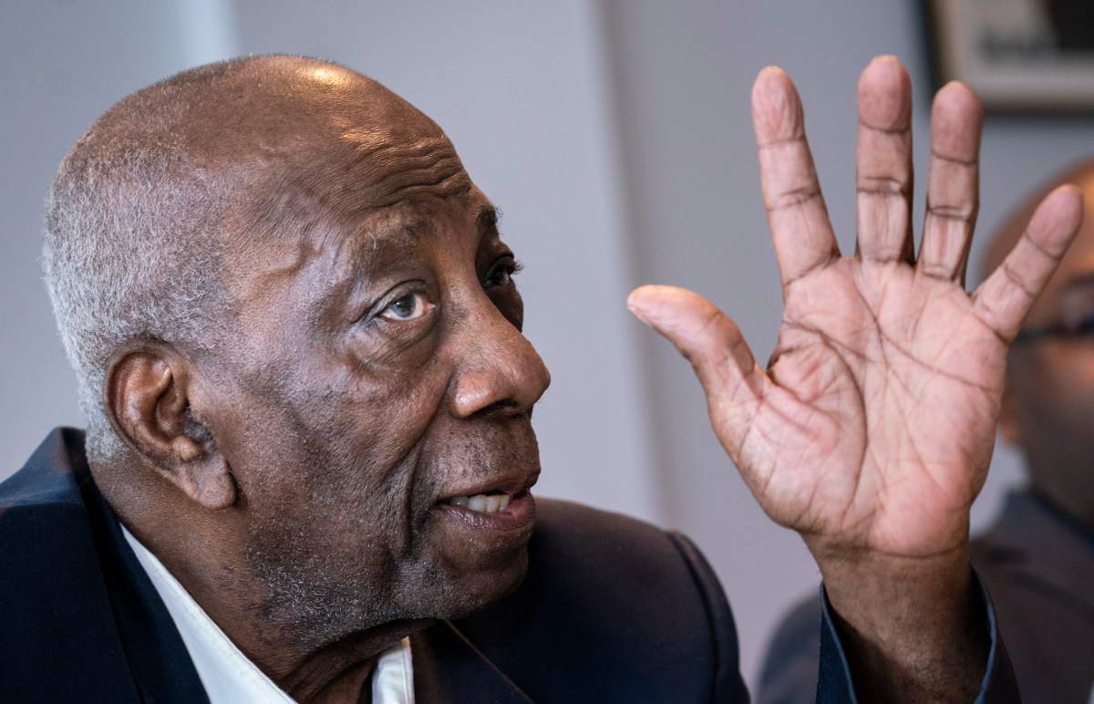 Dan Philip, president of the Black Coalition of Quebec, responds to a question during a news conference in Montreal on Tuesday, August 13, 2019. A Quebec Superior Court judge has authorized a class action lawsuit against the City of Montreal on behalf of citizens who allege they were unfairly arrested and racially profiled by the city's police. 