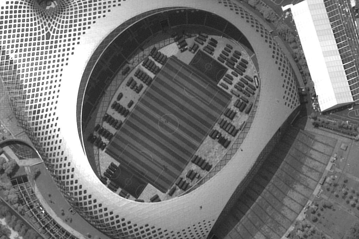 This satellite image captured on Monday, Aug. 12, 2019, provided by Satellite image ©2019 Maxar Technologies appears to show Chinese security force vehicles inside the Shenzen Bay Sports Center in the southern Chinese city of Shenzhen, bordering Hong Kong.