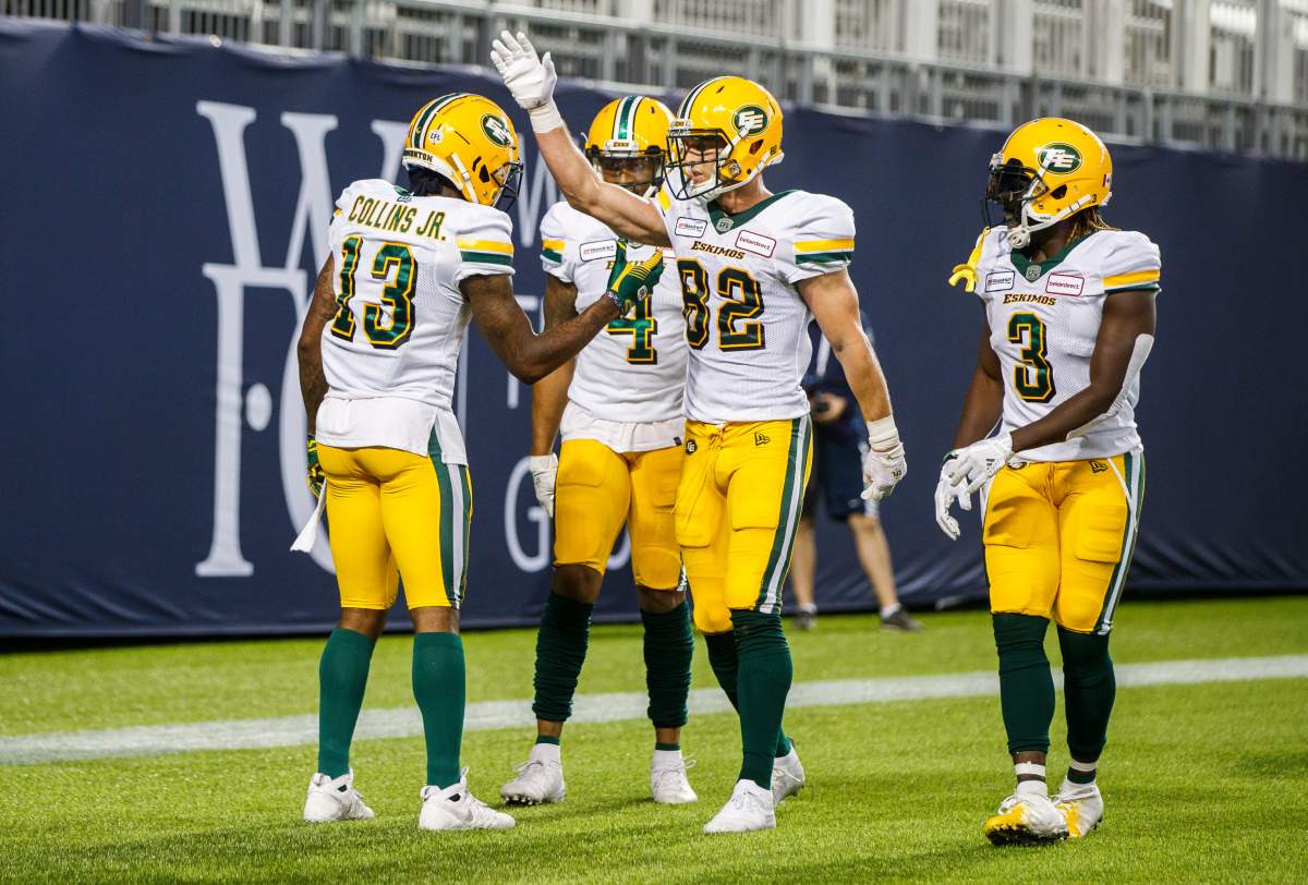 Edmonton Eskimos' Ricky Collins Jr. celebrates his touchdown with Greg Ellingson (82), against the Toronto Argonauts during the first half of CFL football action in Toronto, Friday August 16, 2019. 