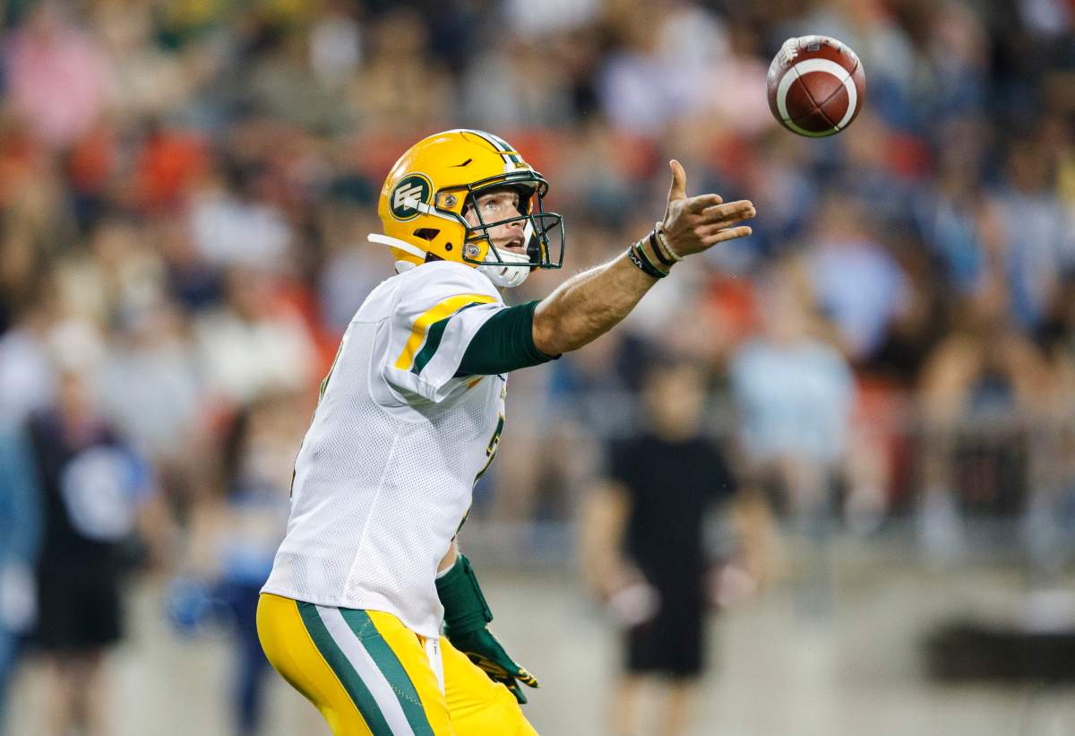 Edmonton Eskimos quarterback Trevor Harris celebrates a touchdown against the Toronto Argonauts during the second half of CFL football action in Toronto, Friday August 16, 2019. 