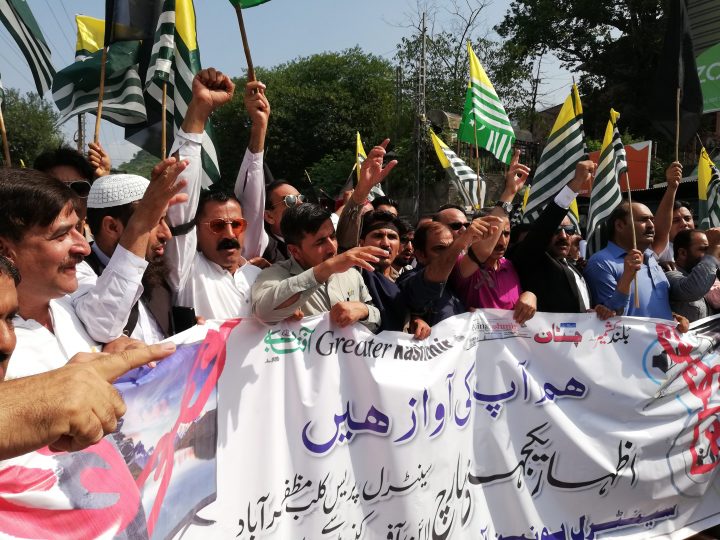 Kashmiri journalists are stopped by Police as they march towards the Line of Control, the de factor border between Indian and Pakistani administered Kashmir, to show solidarity with Indian Kashmir's Journalists near Muzaffarabad, the capital of Pakistani administered Kashmir, Pakistan, 24 August 2019. 