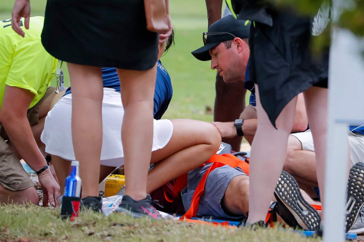 A person is treated by emergency medical personnel after lightning struck a pine tree during a weather delay during the third round of the Tour Championship golf tournament at the East Lake Golf Club in Atlanta, Georgia, USA, 24 August 2019.