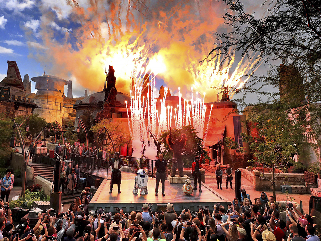 Fireworks blast during the dedication ceremony with invited guests at the entrance of the Star Wars: Galaxy’s Edge attraction at Disney’s Hollywood Studios in Lake Buena Vista, Fla., Wednesday, Aug. 28, 2019.