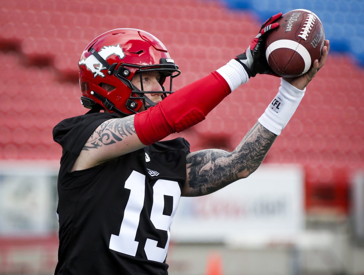 Calgary Stampeders' quarterback Bo Levi Mitchell catches a ball during the first day of training camp in Calgary, Sunday, May 19, 2019. Calgary Stampeders quarterback Bo Levi Mitchell took another step towards returning to the football field with zip on his passes in Friday's practice. The CFL's Most Outstanding Player and Grey Cup MVP in 2018 hasn't played since suffering a tear in the pectoral muscle of his throwing arm in a June 29 game. 