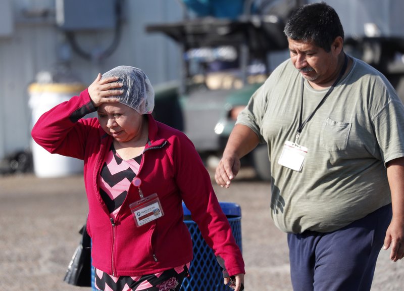 Employees attempt to flee a plant in Mississippi as ICE agents detain undocumented workers.