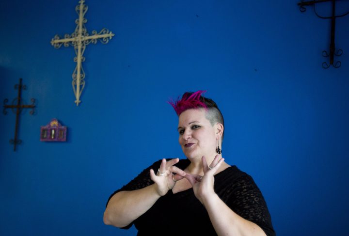 In this file photo from April 23, 2014, Amber Galloway Gallego does the sign for “interpreting.”