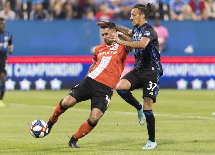 Montreal Impact's Maximiliano Urruti, right, challenges Cavalry FC's Jonathan Wheeldon during first half semifinal Canadian Championship soccer action in Montreal, on August 7, 2019. Cavalry FC, the Calgary-based CPL club, looks to defeat its second straight MLS team when it hosts the Montreal Impact on Wednesday in the second leg of their Canadian soccer championship semifinal. 