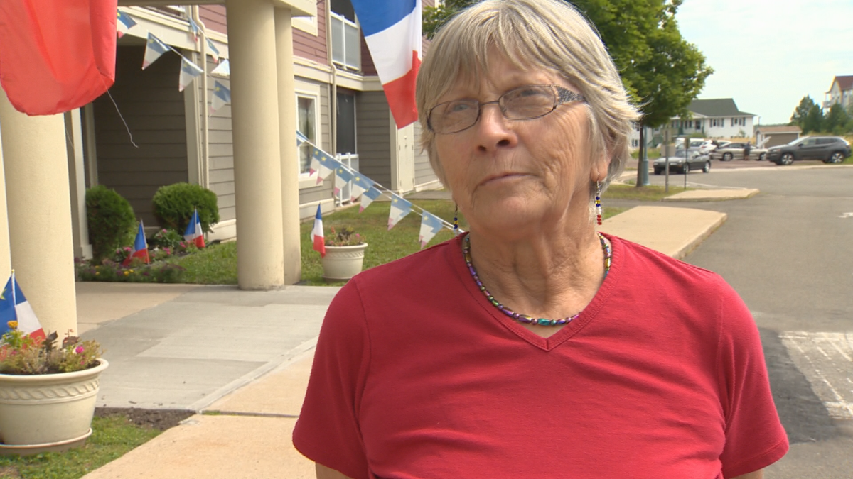 Cécile Vautour decorated her Dieppe apartment with many Acadian flags