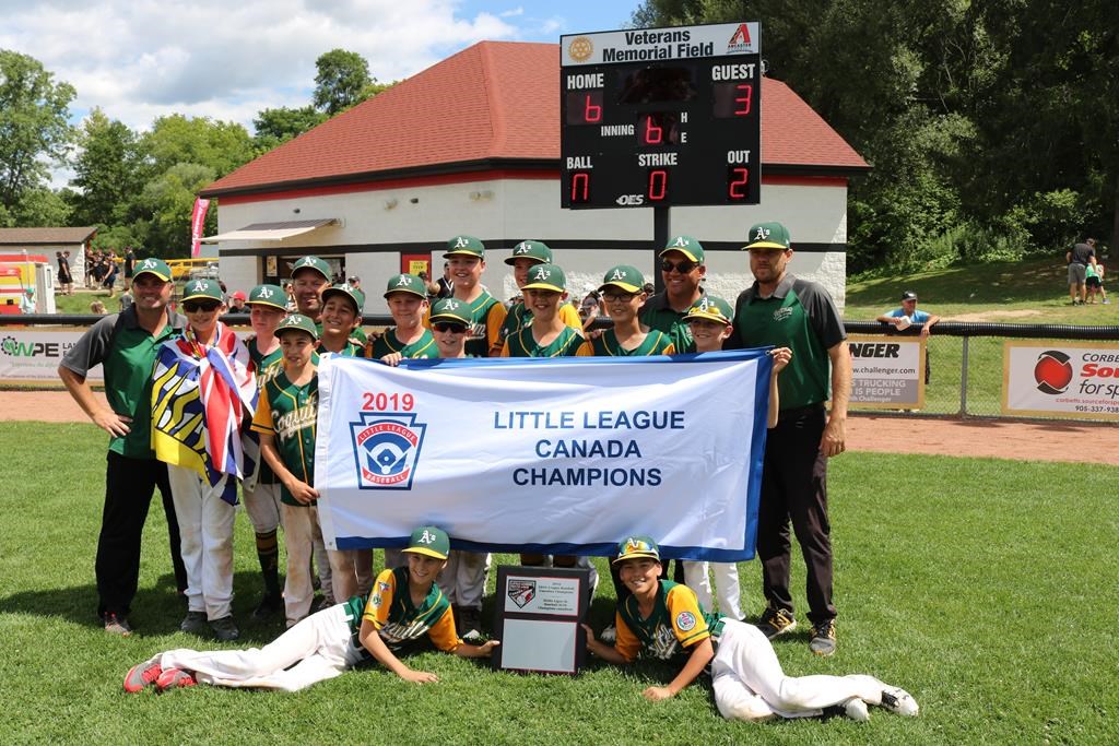 The Coquitlam, B.C., A's Little League baseball team poses after winning the Canadian Little League title in Ancaster, Ont., on Aug. 15, 2019.