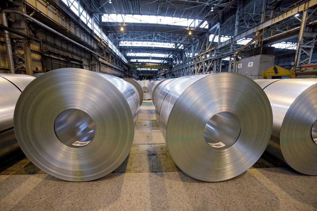 In this Feb. 15, 2013, file photo, finished galvanized steel coils await shipment at ArcelorMittal Steel's hot dip galvanizing line in Cuyahoga Heights, Ohio.