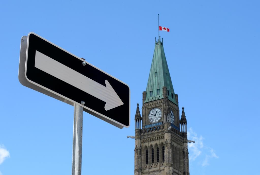 The Peace Tower on Parliament Hill in Ottawa is shown on Sunday, Aug. 2, 2015. A preliminary estimate of the federal books says the government ran a budgetary deficit of $500 million through the first three months of the current fiscal year, compared to a $4.3-billion surplus during the same period a year ago.