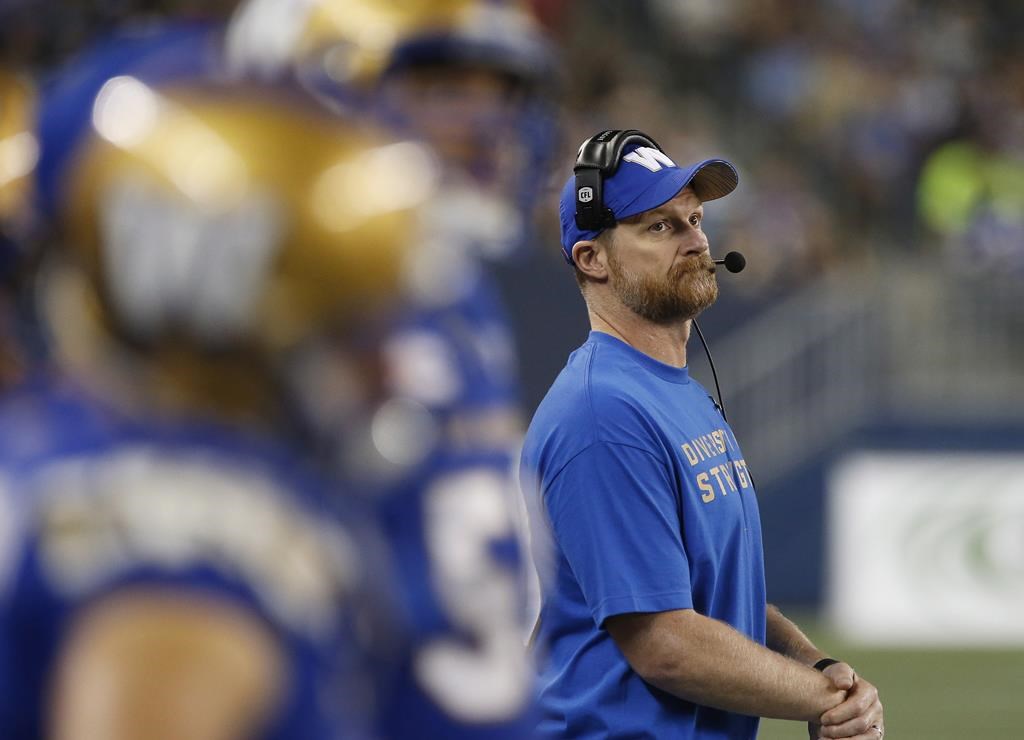 Winnipeg Blue Bombers head coach Mike O'Shea looks up at the scoreboard as they play the Ottawa Redblacks during the second half of CFL action in Winnipeg Friday, August 17, 2018. Another test for head coach O'Shea and the Blue Bombers.The West Division-leading Bombers (8-2) will open an important home-and-home series with the Saskatchewan Roughriders (6-3) on Sunday in Regina. THE CANADIAN PRESS/John Woods.