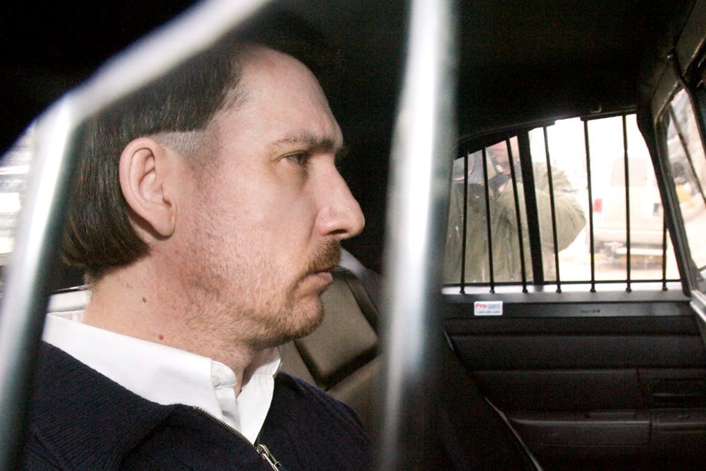 Convicted murderer Curtis Dagenais is escorted from court following sentencing in his murder trial Friday, March 13, 2009, in Saskatoon, Sask. For a Saskatchewan woman who discovered a fugitive Mountie killer hiding in her family's hayfield more than a decade ago, the intense search for two young murder suspects in northern Manitoba stirs old memories.