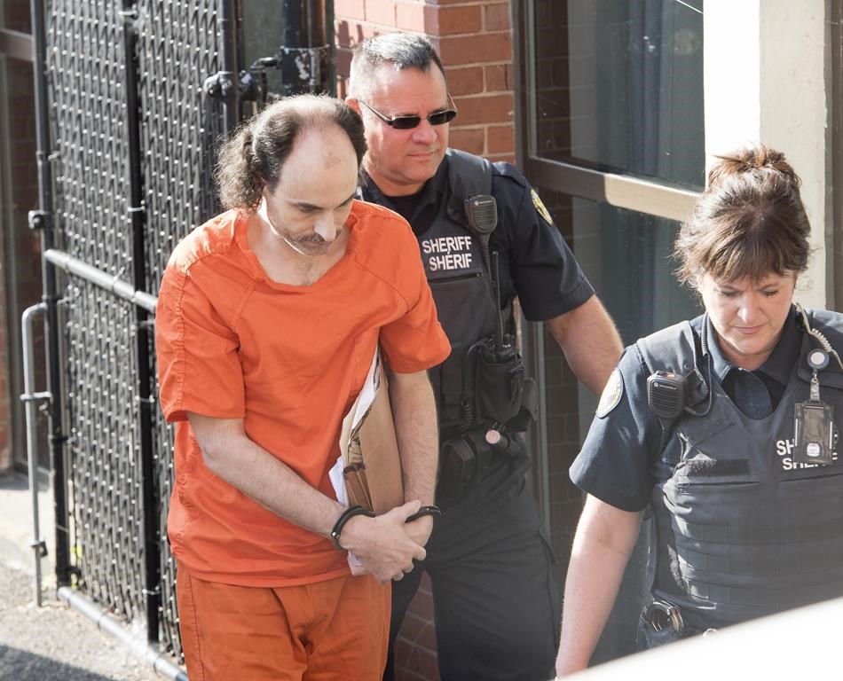 Matthew Vincent Raymond arrives at provincial court in Fredericton on Friday, July 26, 2019. A New Brunswick man accused of murdering four people in a shooting spree in Fredericton last year.