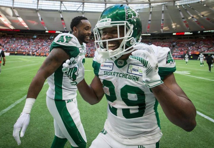 Saskatchewan Roughriders' William Powell, right, and Marcus Thigpen celebrate Powell's third touchdown during the second half of a CFL football game against the B.C. Lions, in Vancouver on Saturday, July 27, 2019.