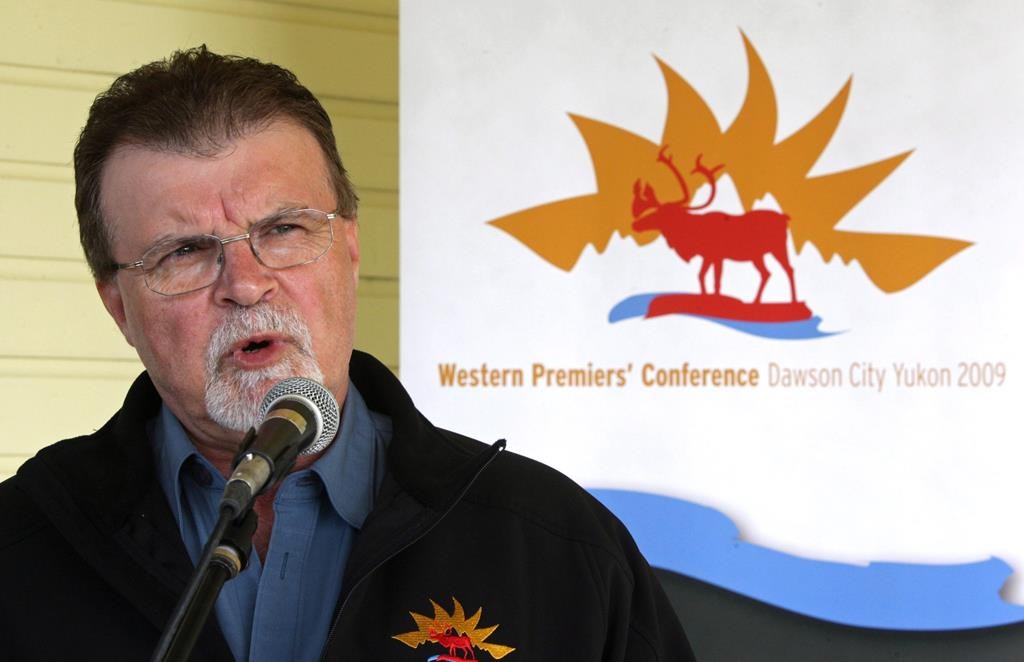 Yukon Premier Dennis Fentie responds to reporters after a day of meetings at the Western Premiers' Conference in Dawson City, Yukon, on June 18, 2009.