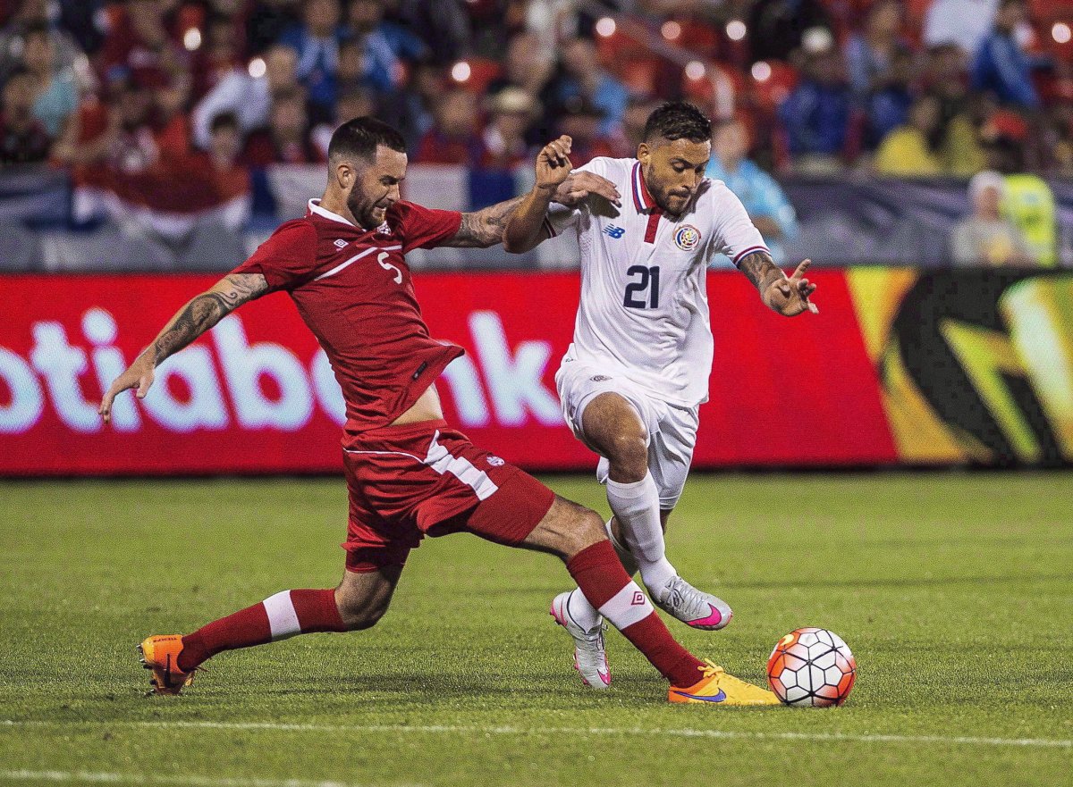 David Edgar (left) of Canada battles for the ball against David Ramirez of Costa Rica during the CONCACAF Gold Cup soccer action in Toronto on July 14, 2015.