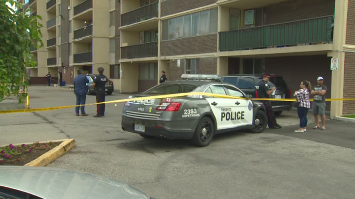 Toronto police at the scene of a shooting near Kipling Avenue and Dixon Road on Sunday.
