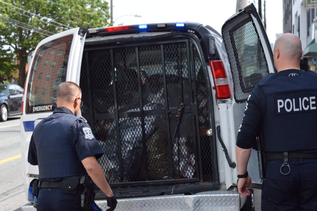 Halifax Regional Police close the doors of van full of cannabis and cannabis products they seized from Farm Assists on Aug. 1, 2019.