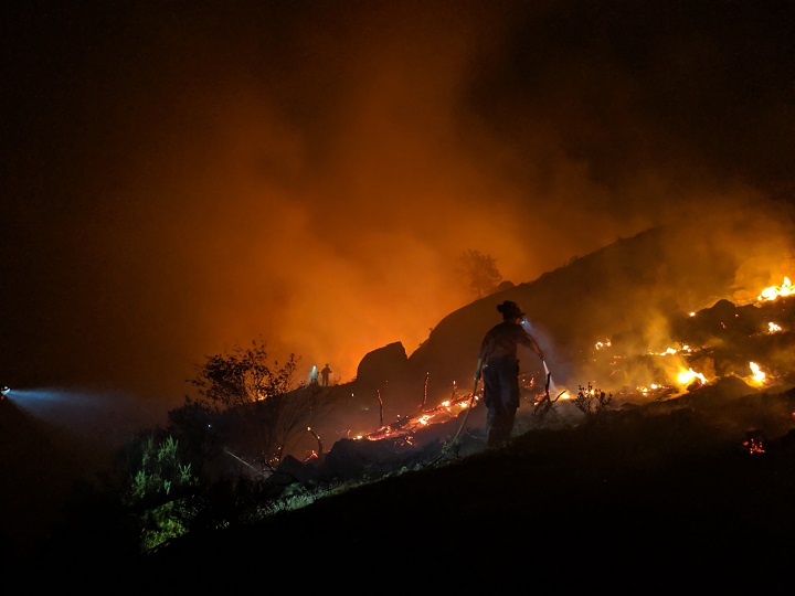 BC Wildfire Service firefighters battling the Eagle Bluff wildfire at night on Aug. 11.