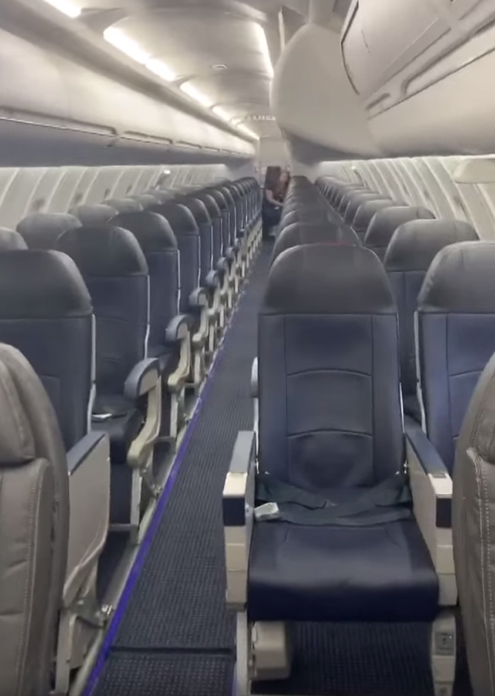 This still image from video recorded by Vincent Peone shows all the empty seats on his flight from Aspen, Colo., to Salt Lake City, Utah.