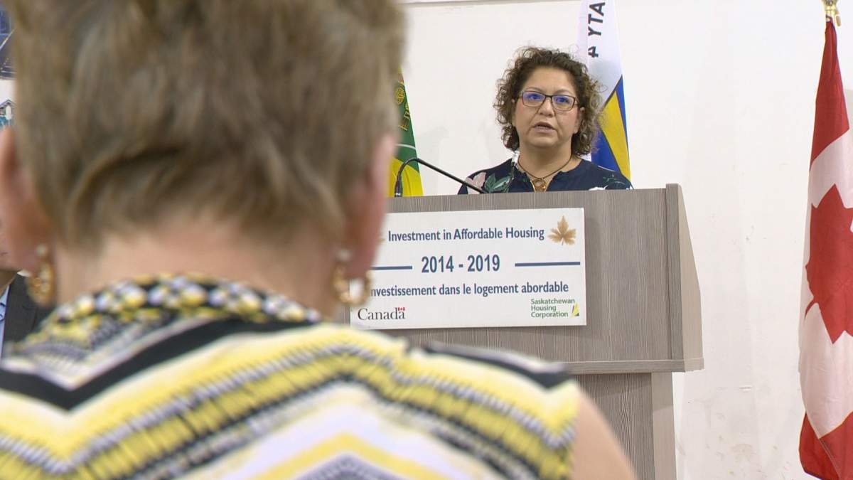 Regina Treaty/Status Indian Services executive director Erica Beaudin speaks at the podium for Monday’s crisis housing announcement.