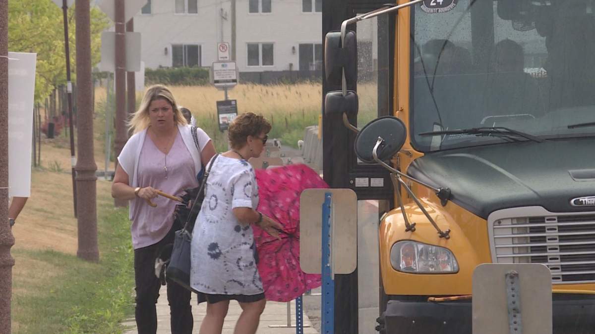 Riders hop onto the Shuttle bus at the Vaudreuil train station. 