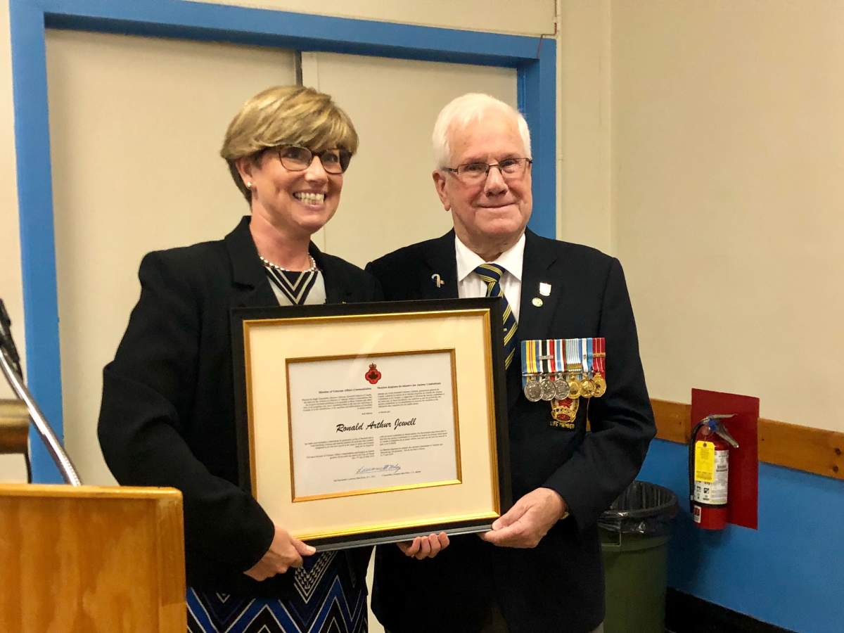 Elgin-Middlesex-London MP Karen Vecchio presents Ron Jewell with the Minister of Veterans Affairs Commendation for his work with the Royal Canadian Legion.