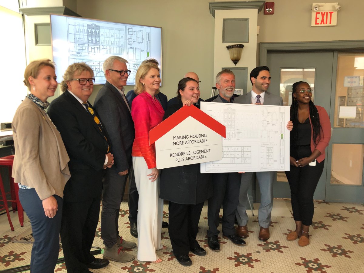 Parliamentary Secretary Adam Vaughan (third from left) announces funding for Youth Opportunities Unlimited's new supportive housing project for young adults leaving CAS.